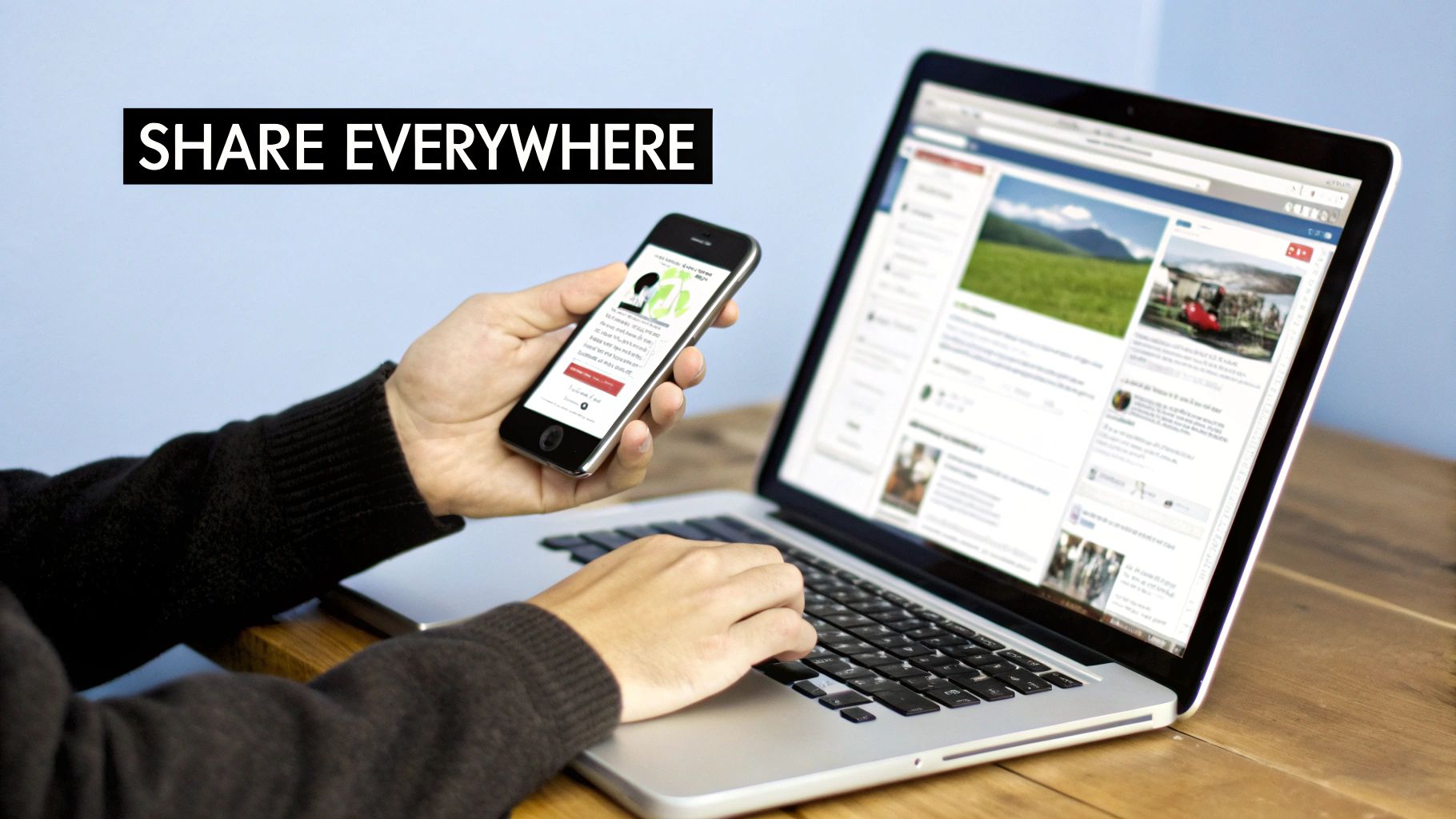 A person simultaneously using a laptop and smartphone for sharing content across social media platforms.