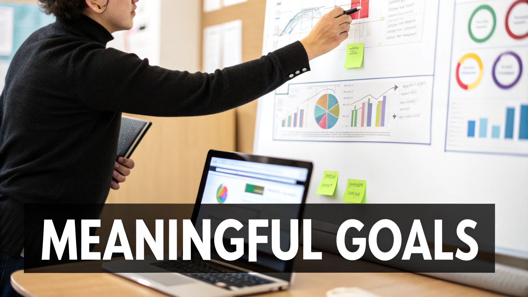 A person pointing to a dartboard, symbolizing setting clear and in-depth goals.