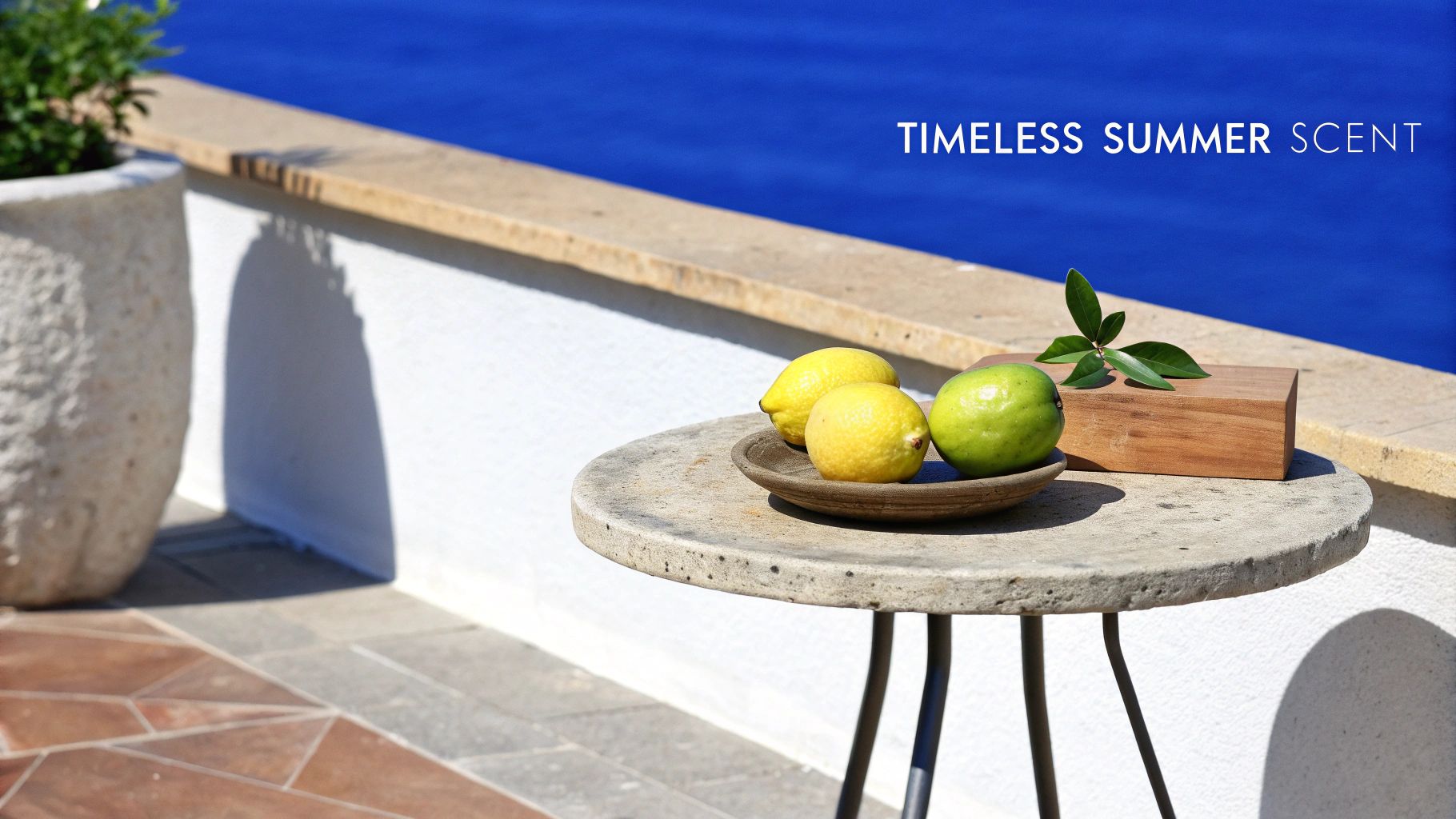 Mediterranean summer scene with fresh lemons and lime on concrete table by blue pool