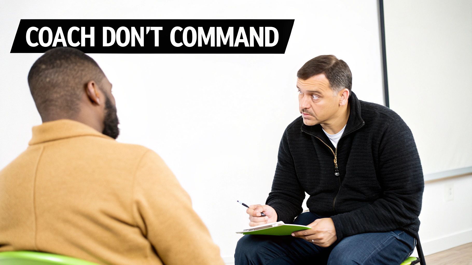 Two men in a professional coaching session with "COACH DON'T COMMAND" banner.