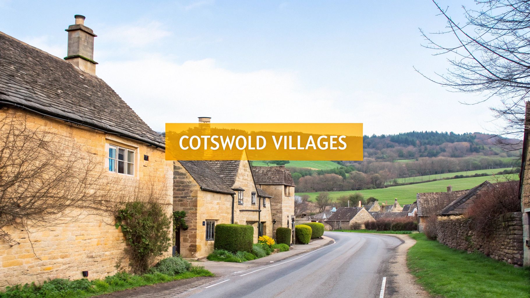 Cotswold village street with traditional honey-colored stone cottages, green hills, and a curving road.