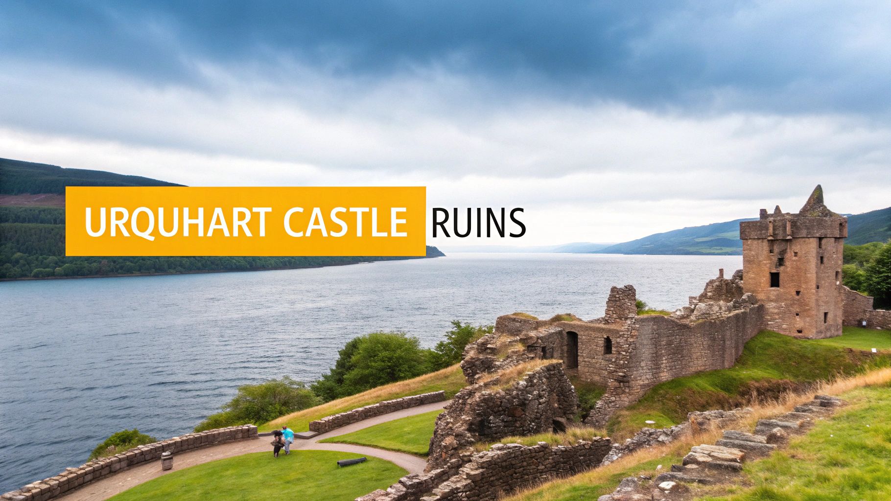 Urquhart Castle ruins stand majestically by the dark waters of Loch Ness under a dramatic cloudy sky.