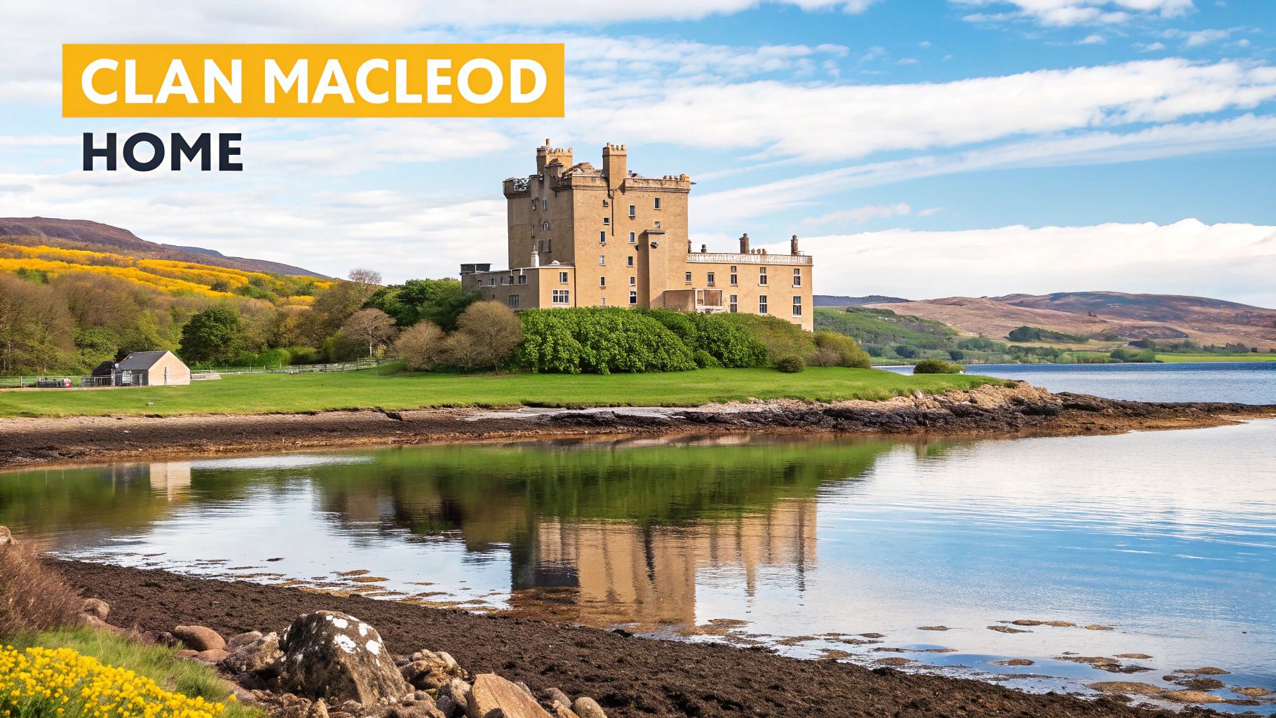 Dunvegan Castle, historic home of Clan MacLeod, stands proudly by a loch on the Isle of Skye, Scotland.