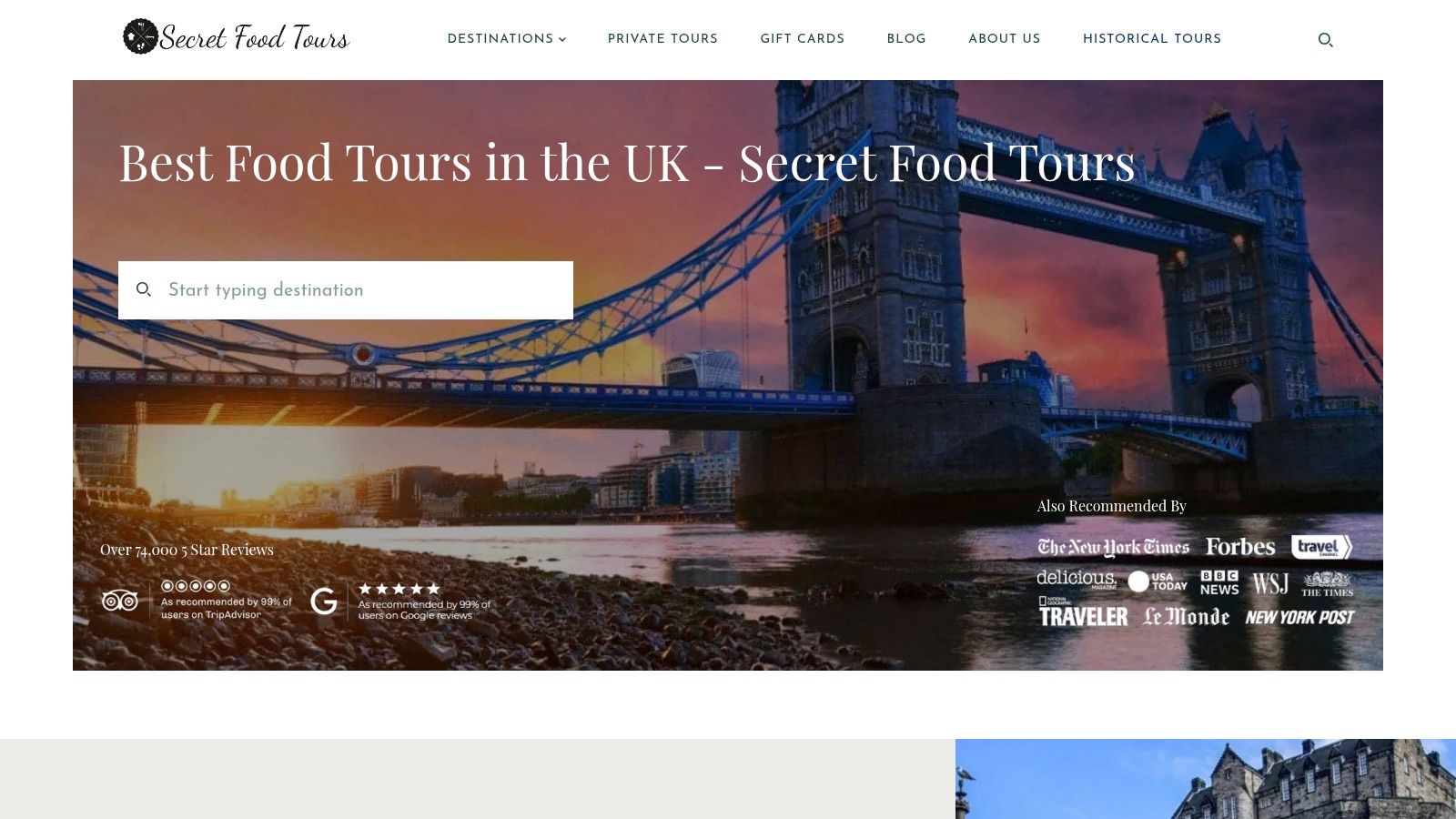 A guide from Secret Food Tours presents a plate of food to a tour group in a cosy restaurant setting.