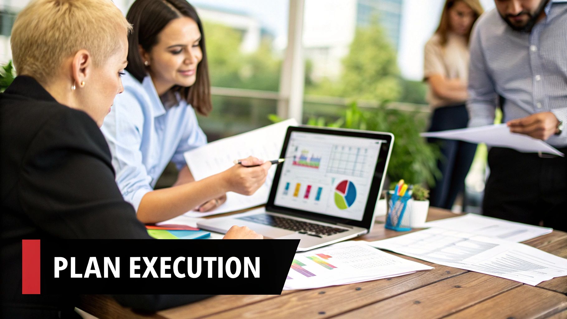 A person presenting a business plan on a screen in a modern office meeting.