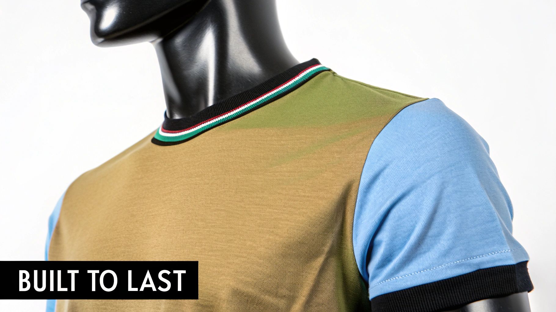 Close-up of a multi-color t-shirt with brown, green, and blue sections on a black mannequin, featuring a striped collar.