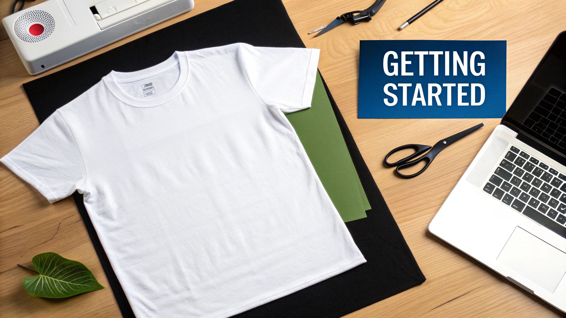 A person using a heat press machine to transfer a design onto a white t-shirt.