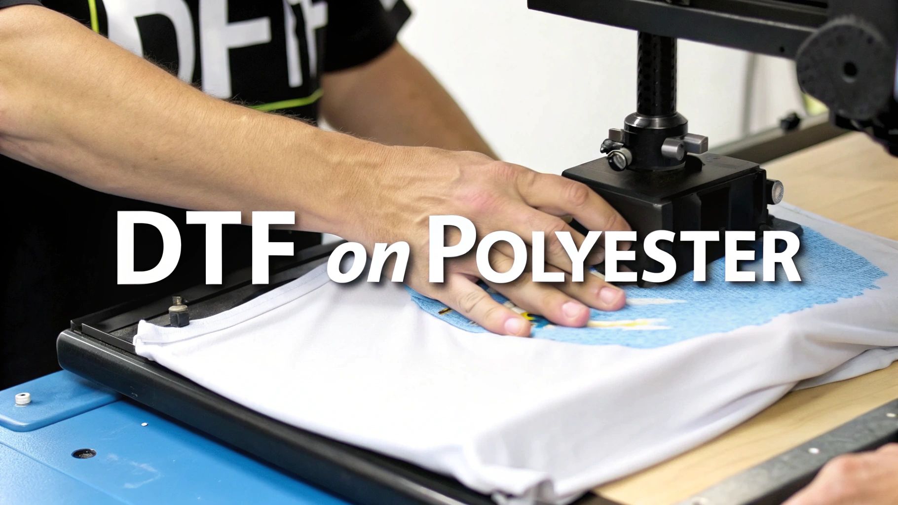 Hands positioning polyester fabric on heat press machine for direct to film printing process