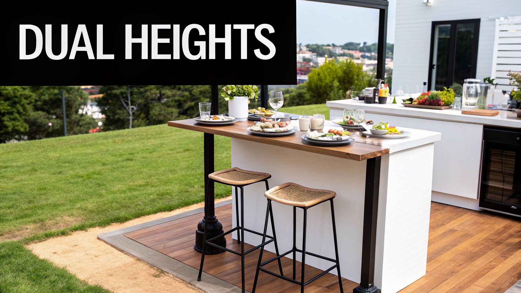 An outdoor kitchen features a dual-height bar and counter, set for dining and entertaining.