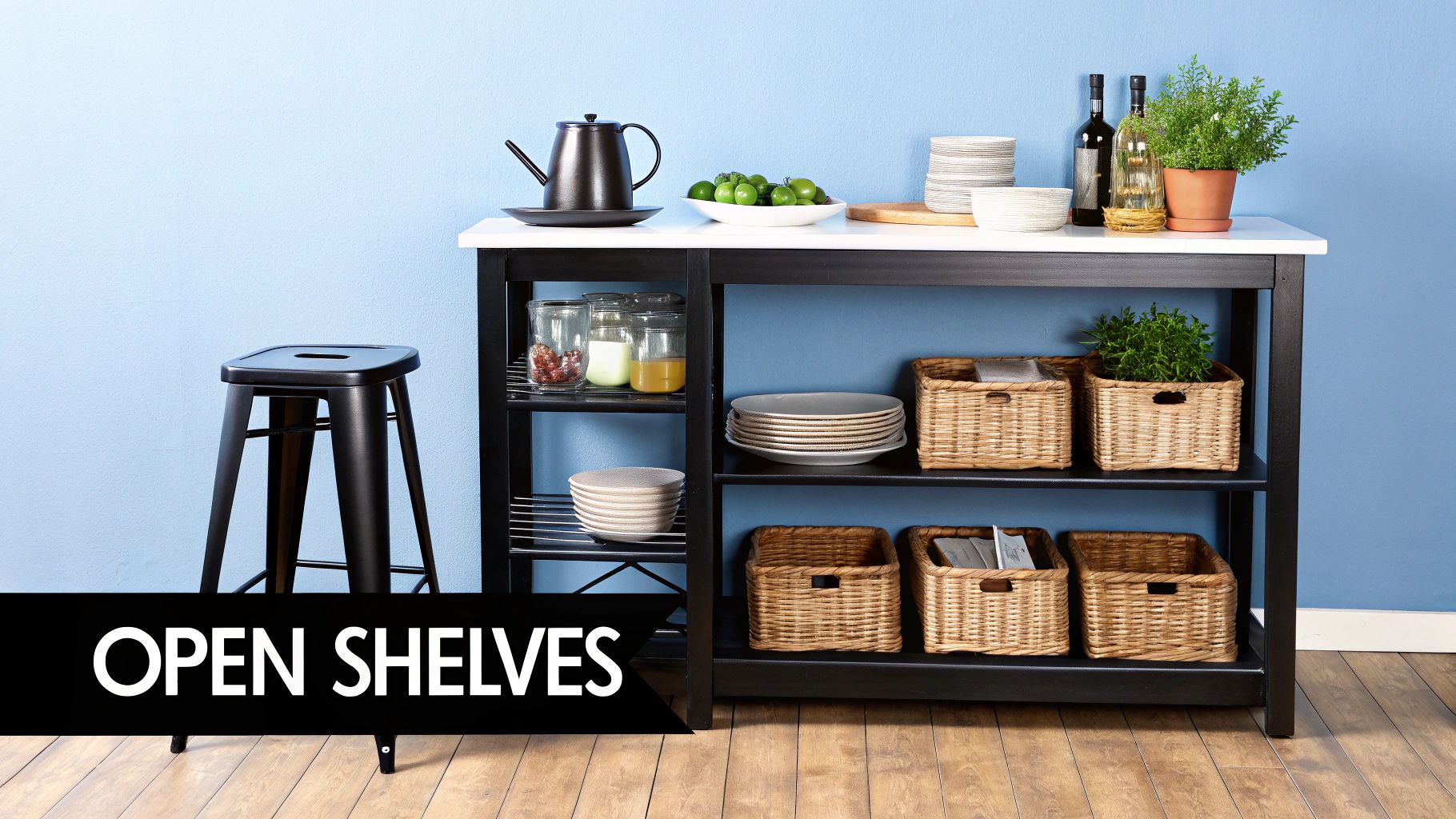 Modern black kitchen island with a white top, open shelves, and various kitchen items.
