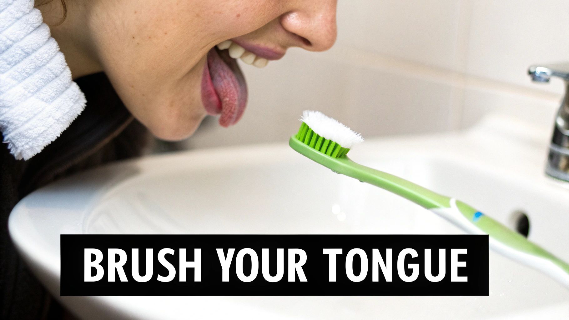 A person extends their tongue towards a toothbrush, ready to brush it in a bathroom setting, promoting oral hygiene.