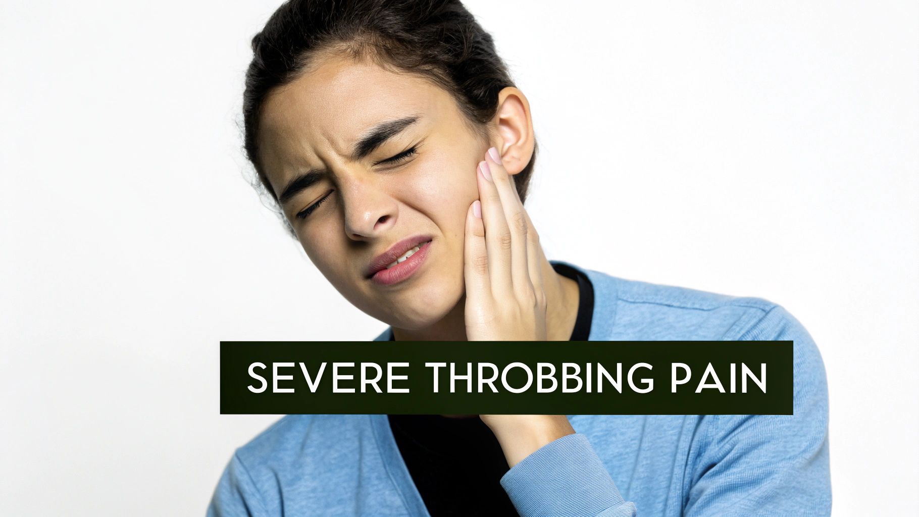 A young woman with a pained expression holding her jaw, indicating severe throbbing pain.