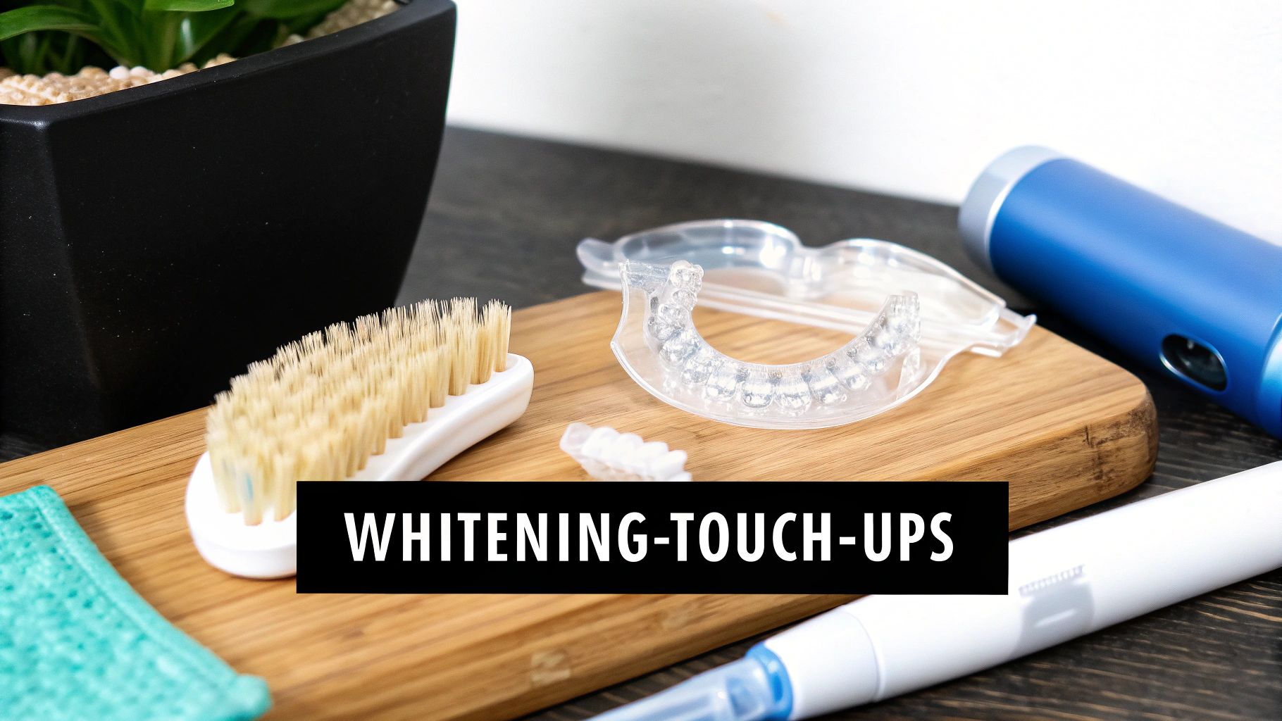 Various teeth whitening products including a mouth tray, brush, and pen, displayed on a wooden board.