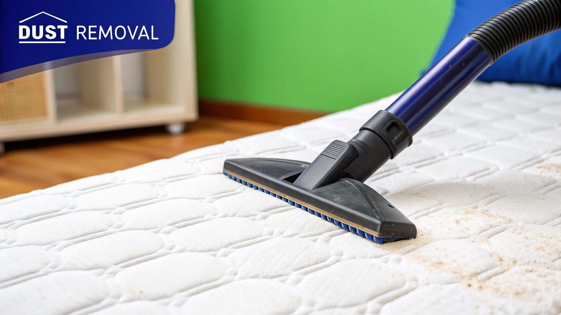 A person vacuuming a mattress with an upholstery attachment, showing the initial debris removal step.