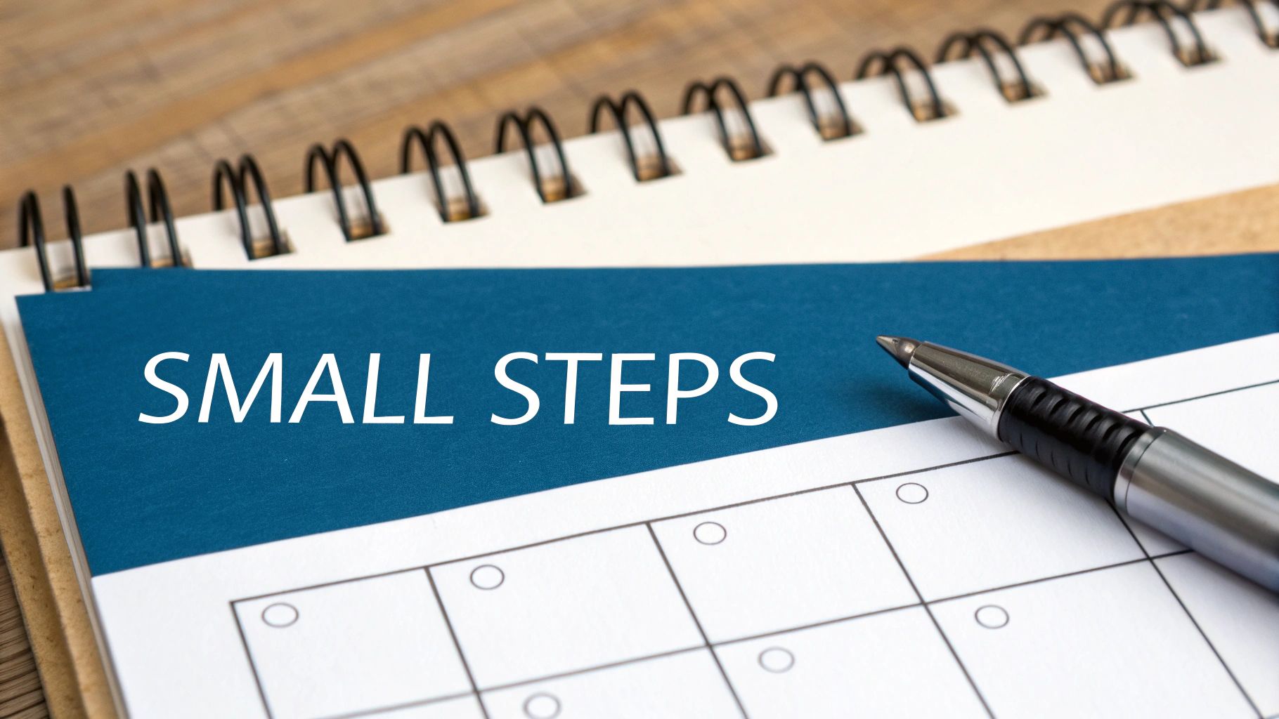 A person taking a small first step up a large staircase, symbolizing building momentum.
