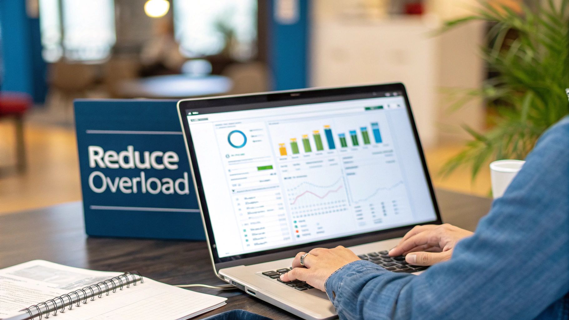 Person using laptop reviewing analytics dashboard with reduce overload sign promoting productivity and decision making