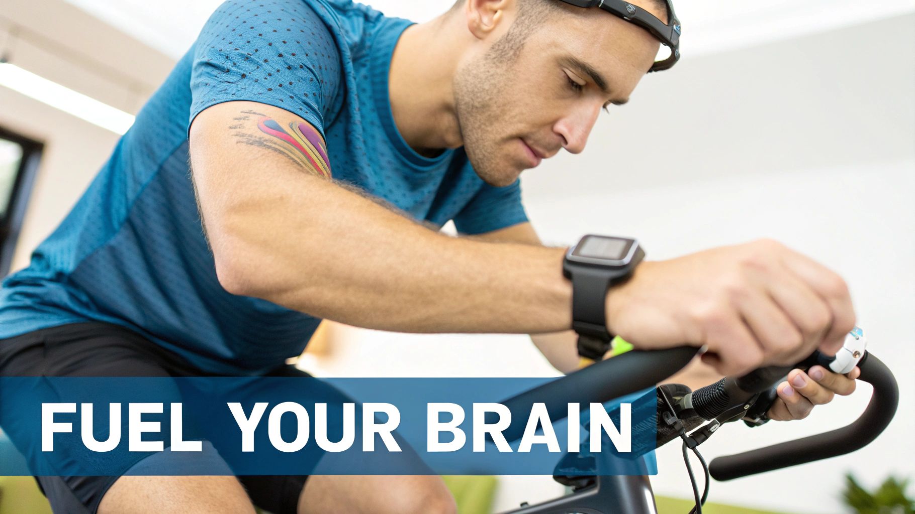 A man in activewear on an indoor bike, wearing a brain-sensing headband and smartwatch.