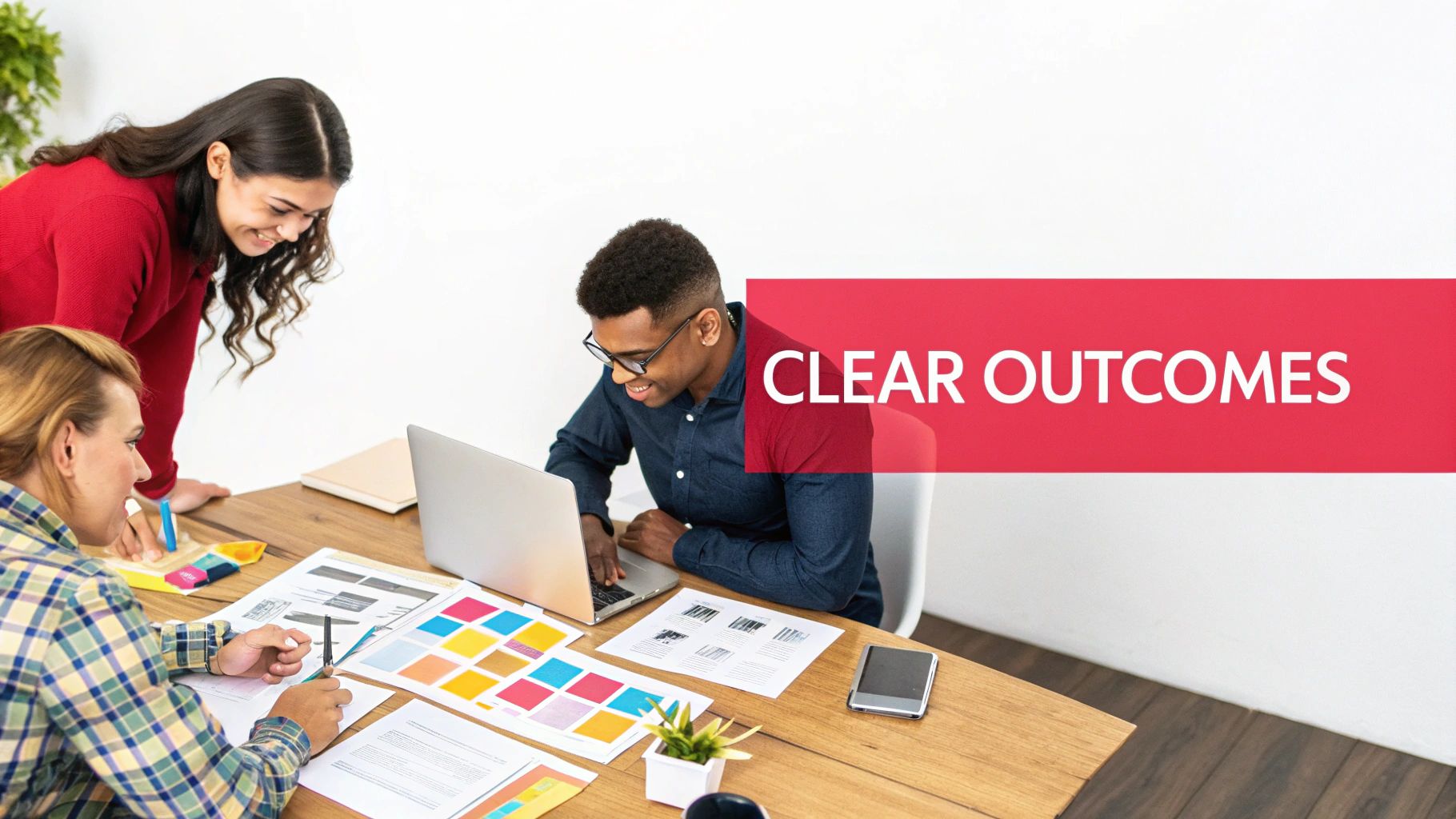 A diverse team of three professionals collaborates on design documents and a laptop, with 'CLEAR OUTCOMES' text.