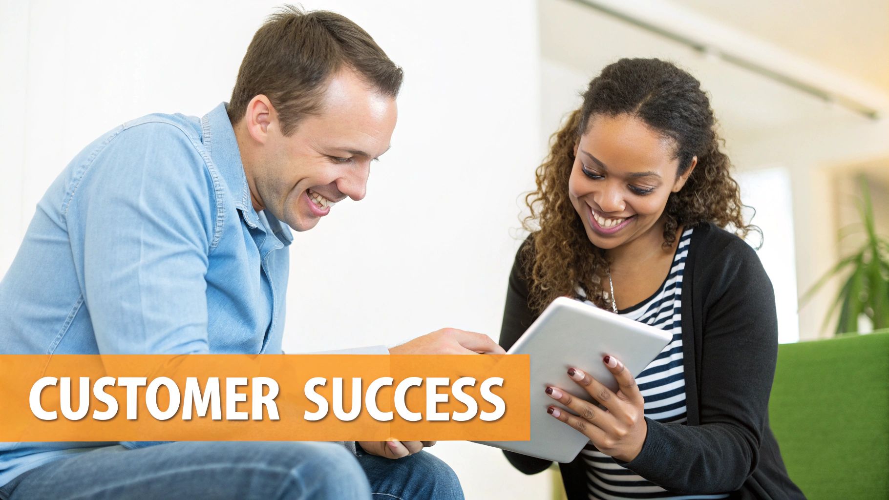 Customer success professional showing tablet to happy client during consultation meeting