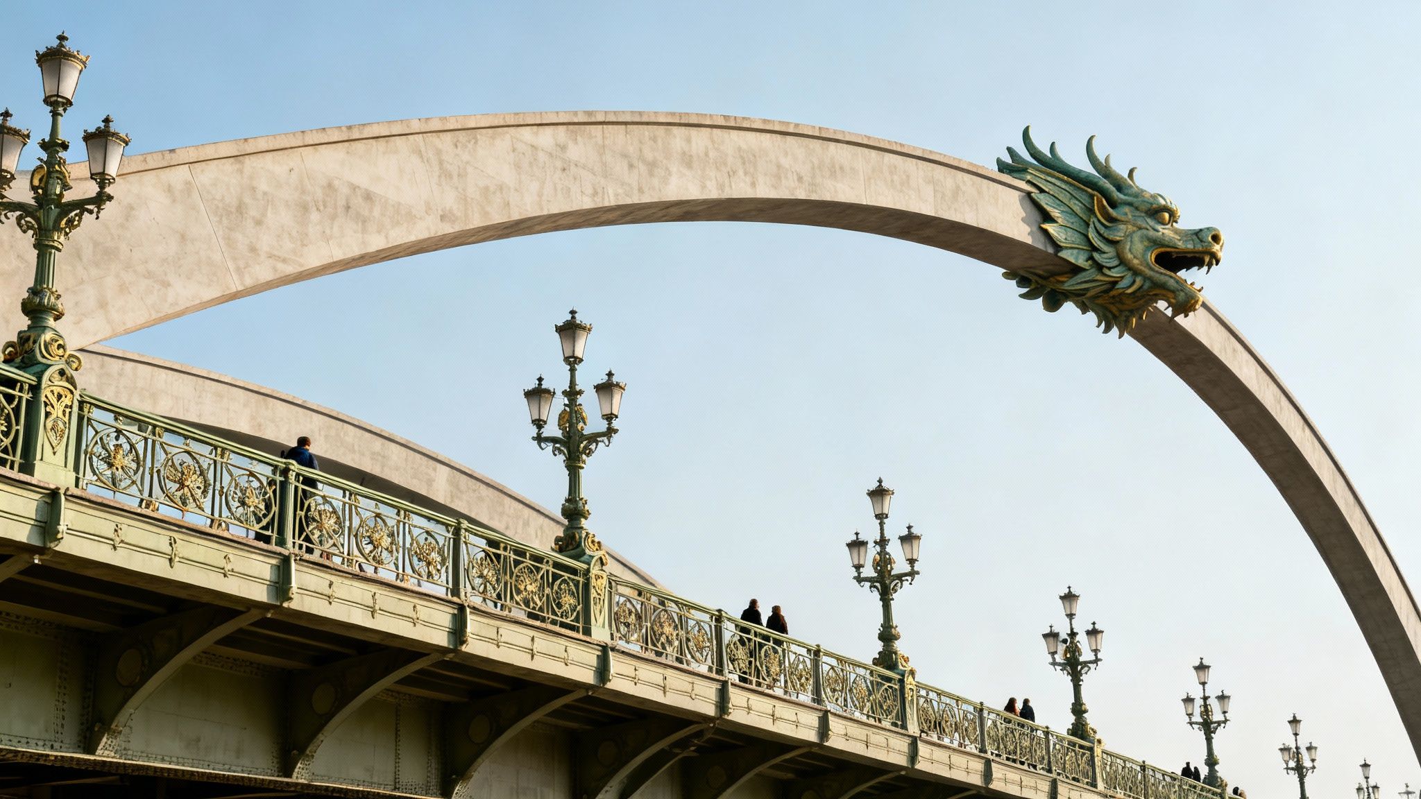 A historic bridge with ornate lampposts and a large arch featuring a prominent green dragon head sculpture against a blue sky.