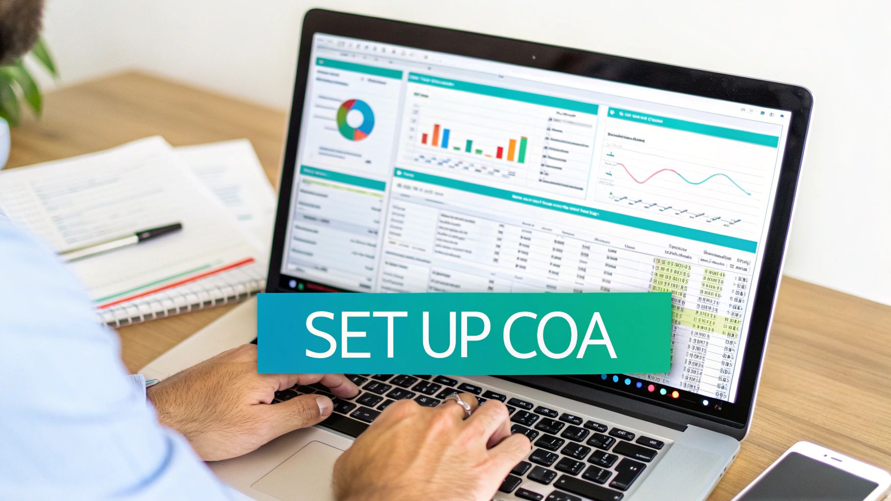 Person working on a laptop, setting up a chart of accounts on a financial dashboard.