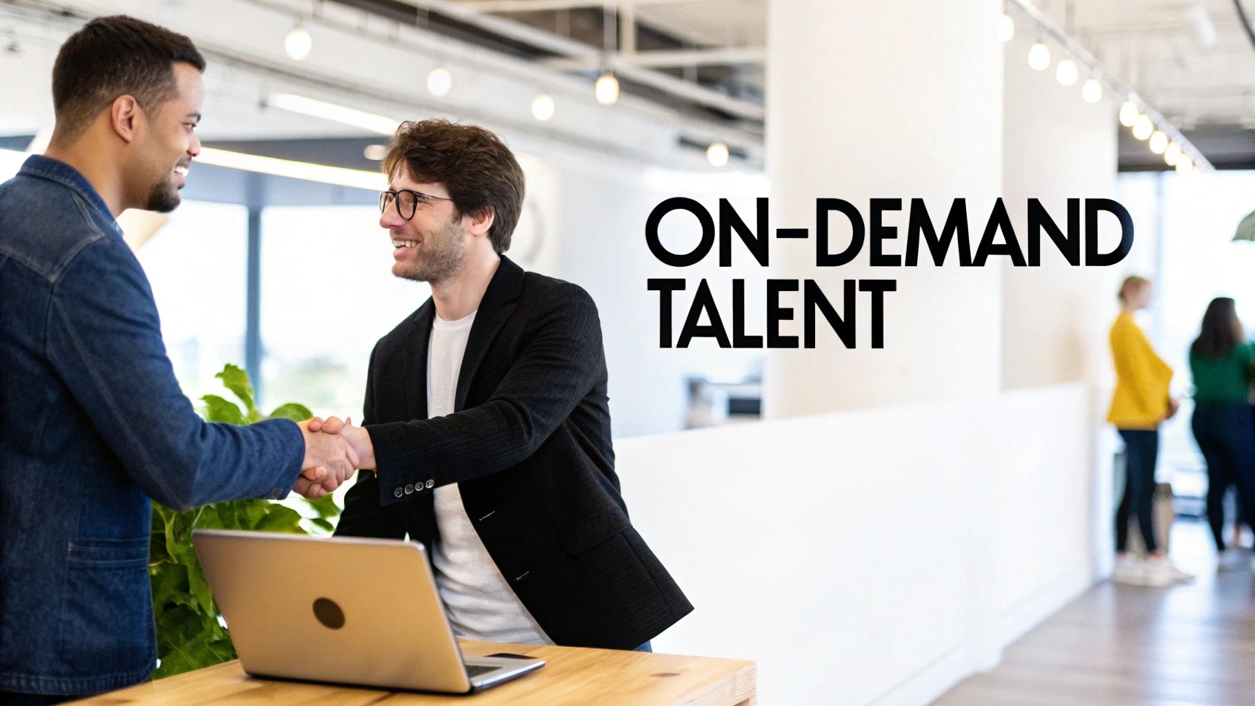 Two diverse business professionals smiling and shaking hands over a laptop, with 'ON-DEMAND TALENT' text visible.