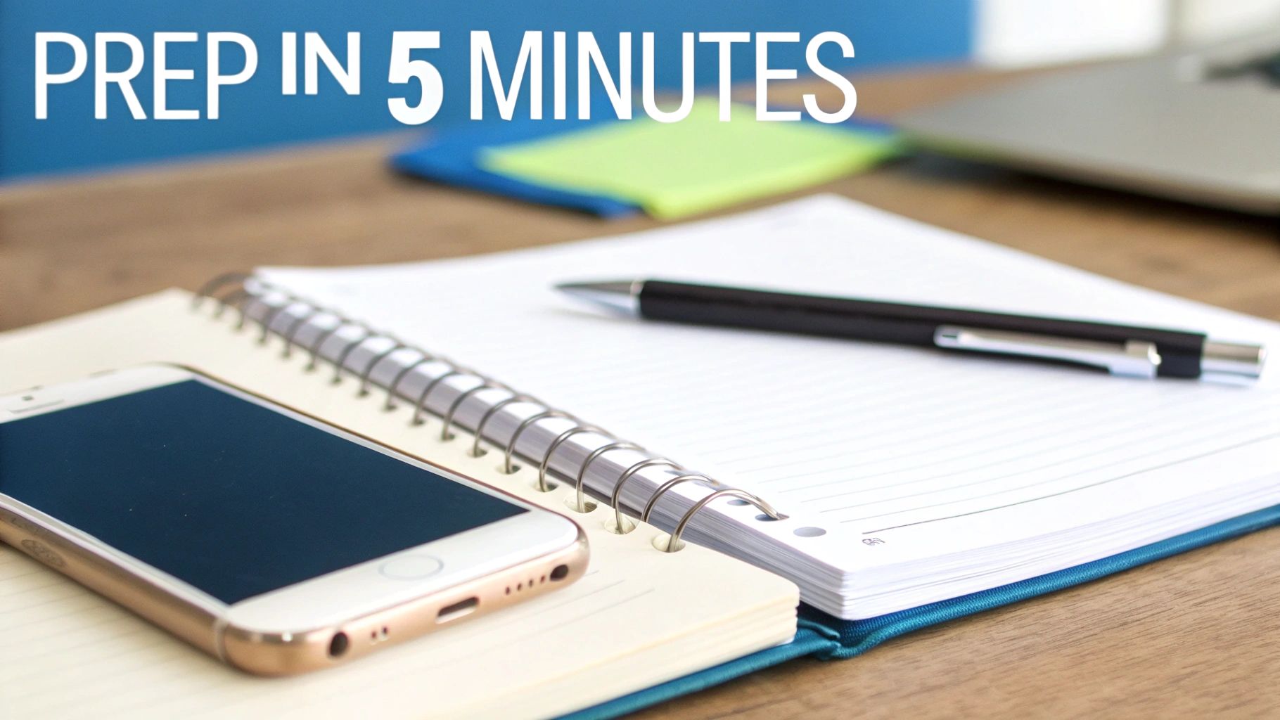 A gold smartphone, open spiral notebook, and pen on a wooden desk with 'PREP IN 5 MINUTES' text.