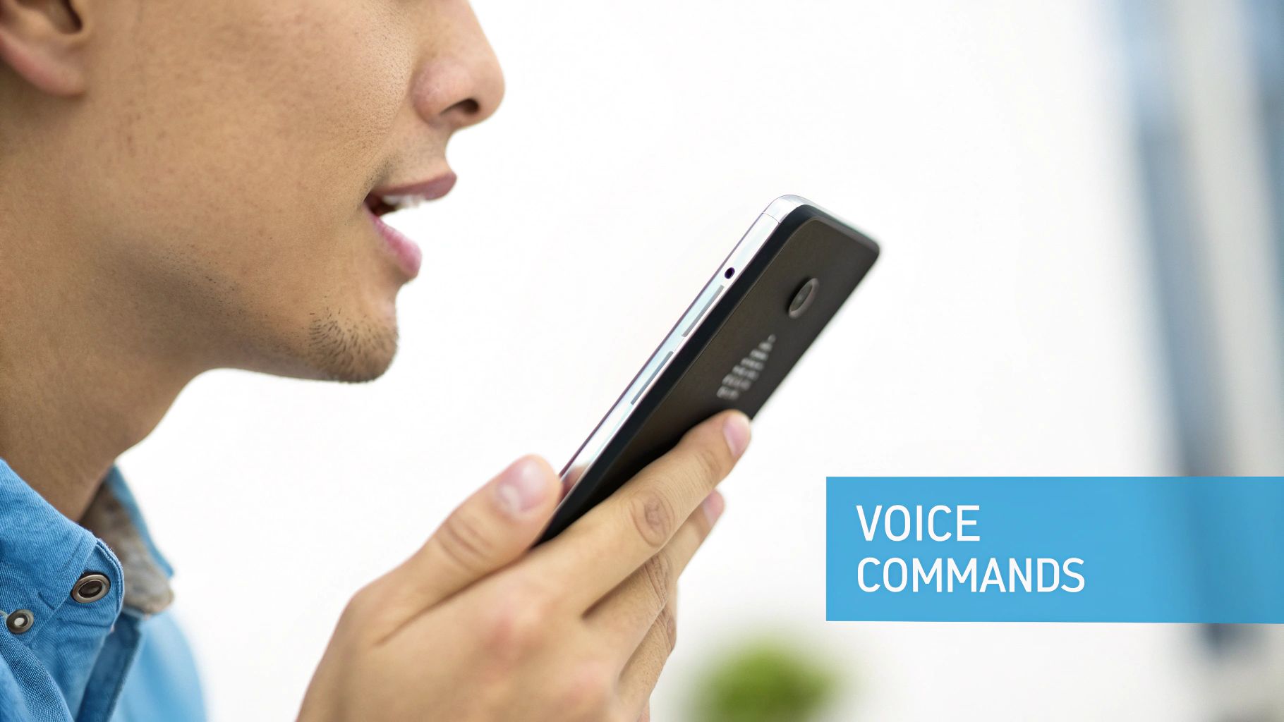 Close-up of a person speaking into a smartphone, demonstrating voice commands for interaction.