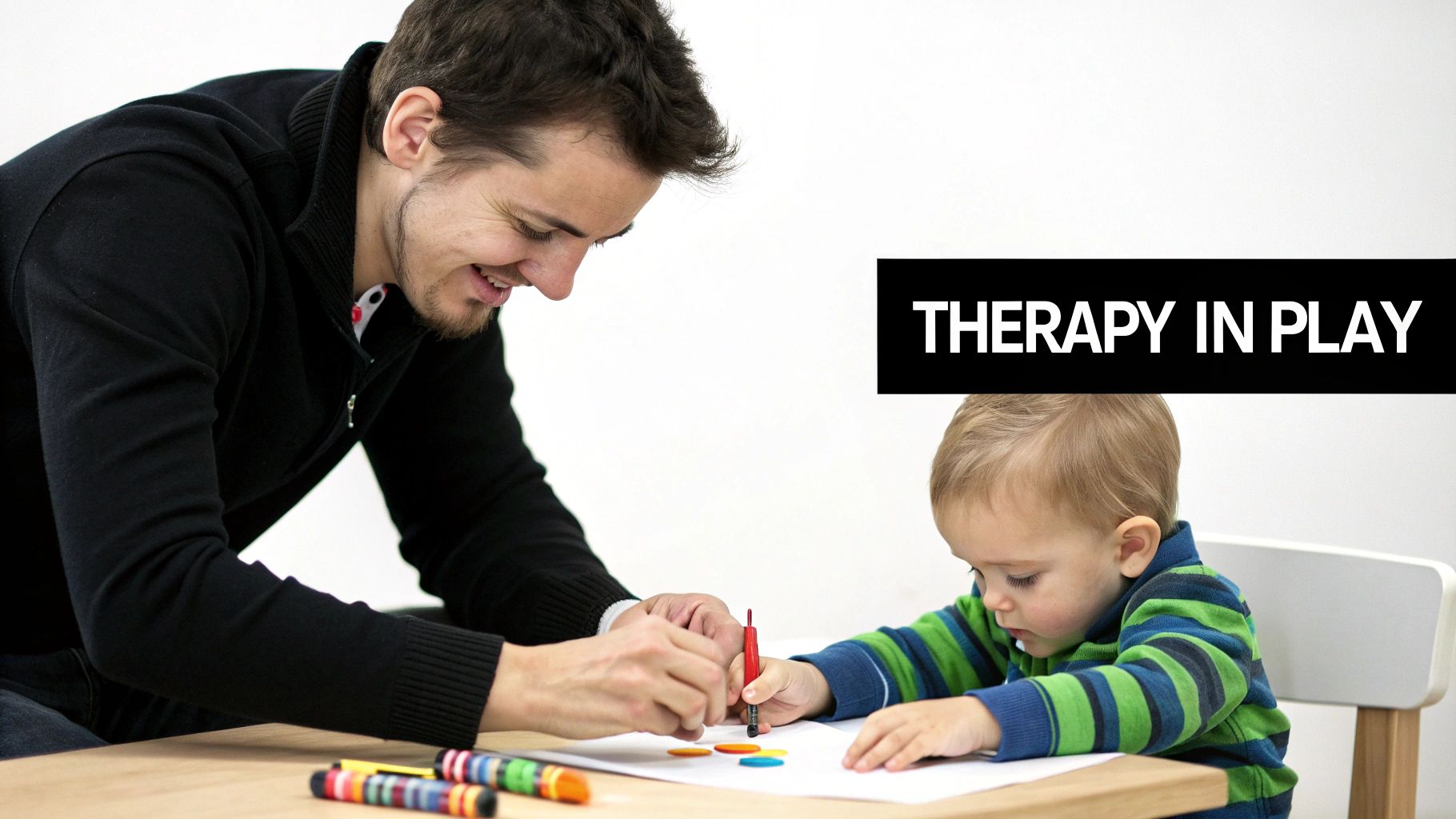 A therapist using colourful blocks to engage a young child during an early intervention program session.