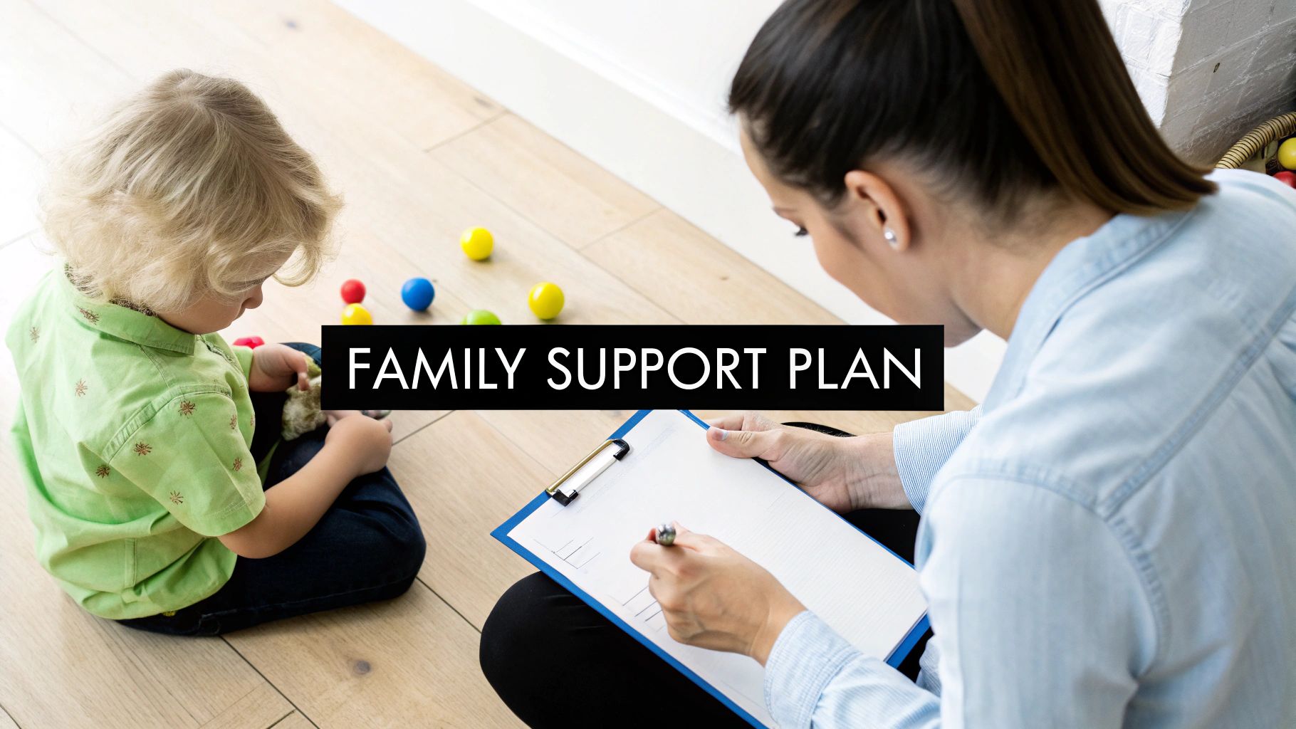 A family and a therapist sitting together at a table, collaboratively working on a document.
