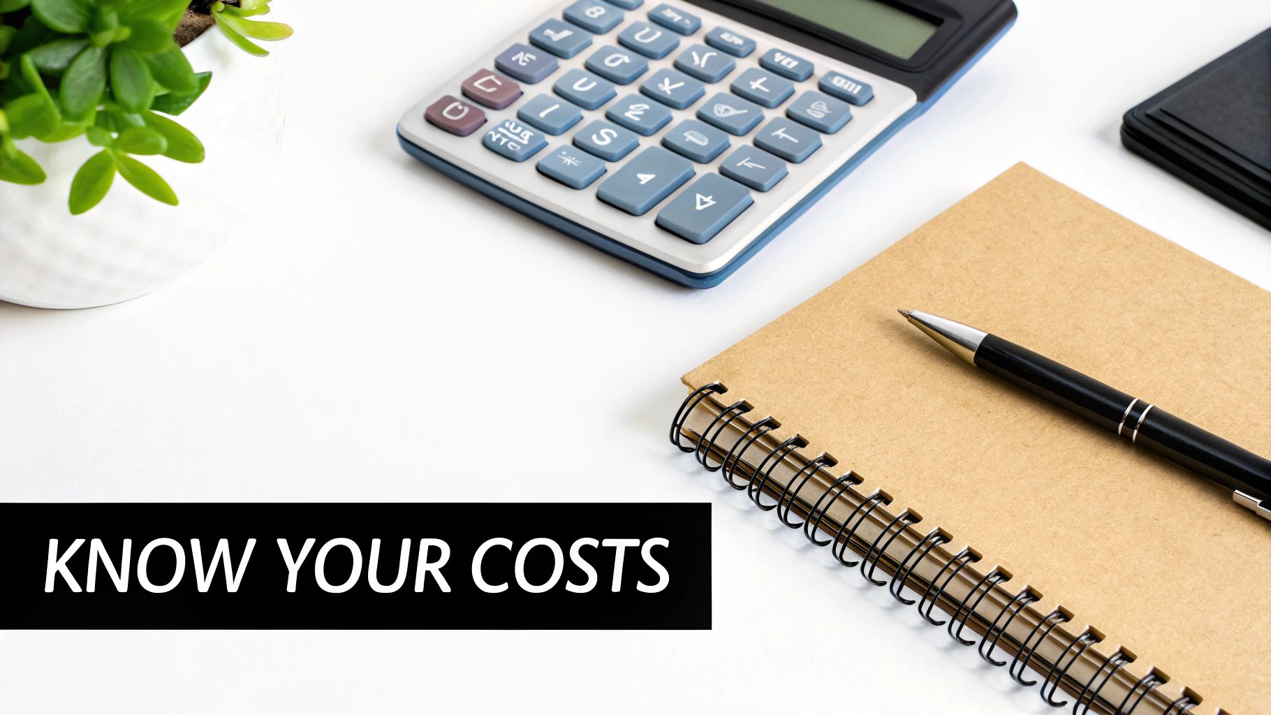 A calculator and pen resting on financial documents, symbolising budgeting for accounting services.