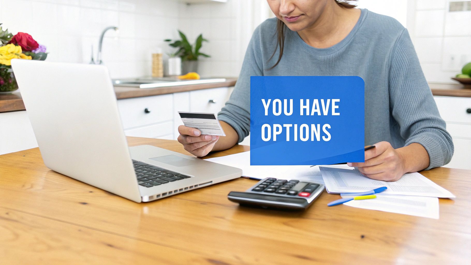 Woman holding a credit card, using a laptop and calculator, with a 'YOU HAVE OPTIONS' graphic.