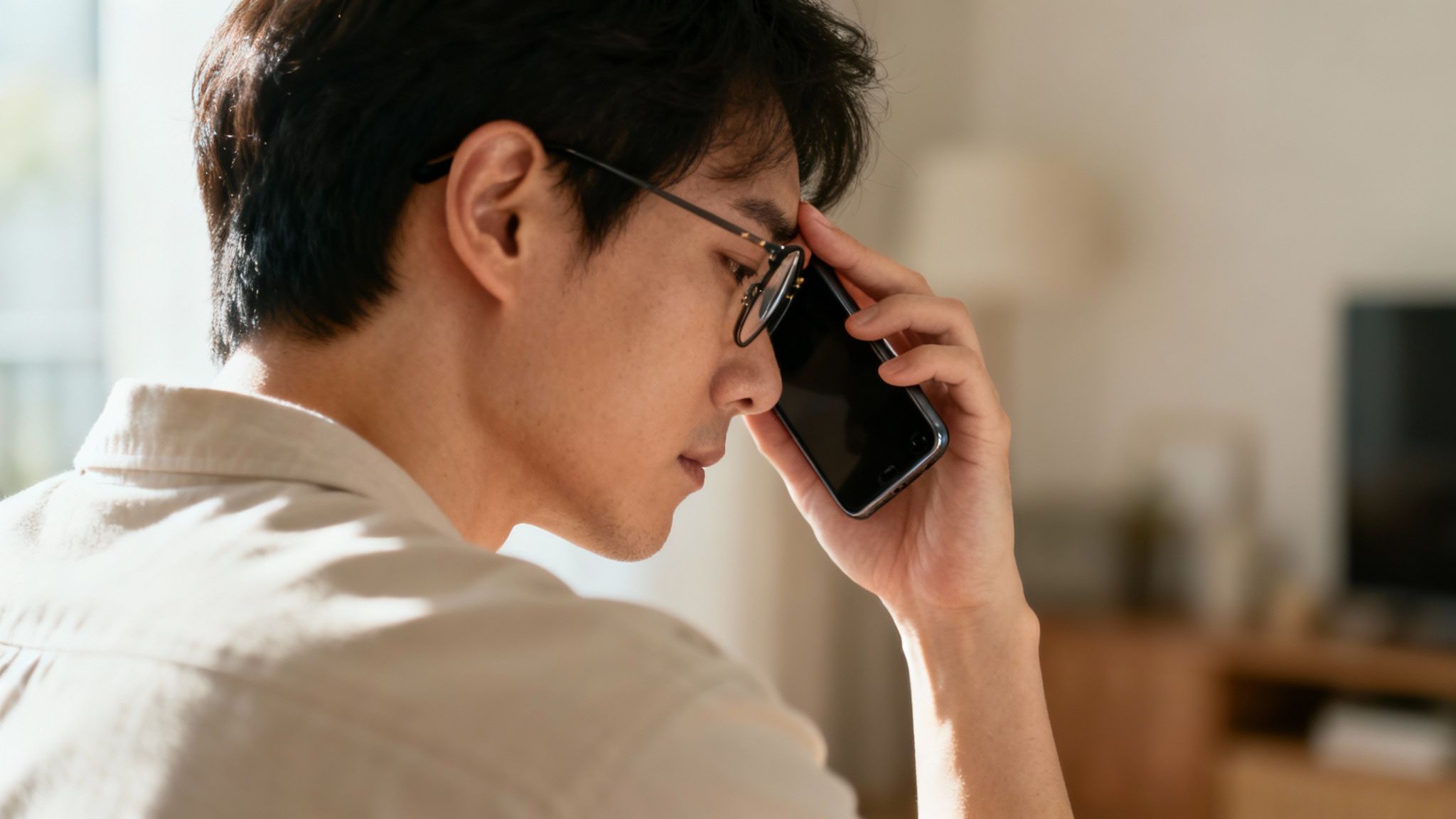 A friendly optometrist checking a patient's new eyeglasses for a perfect fit.