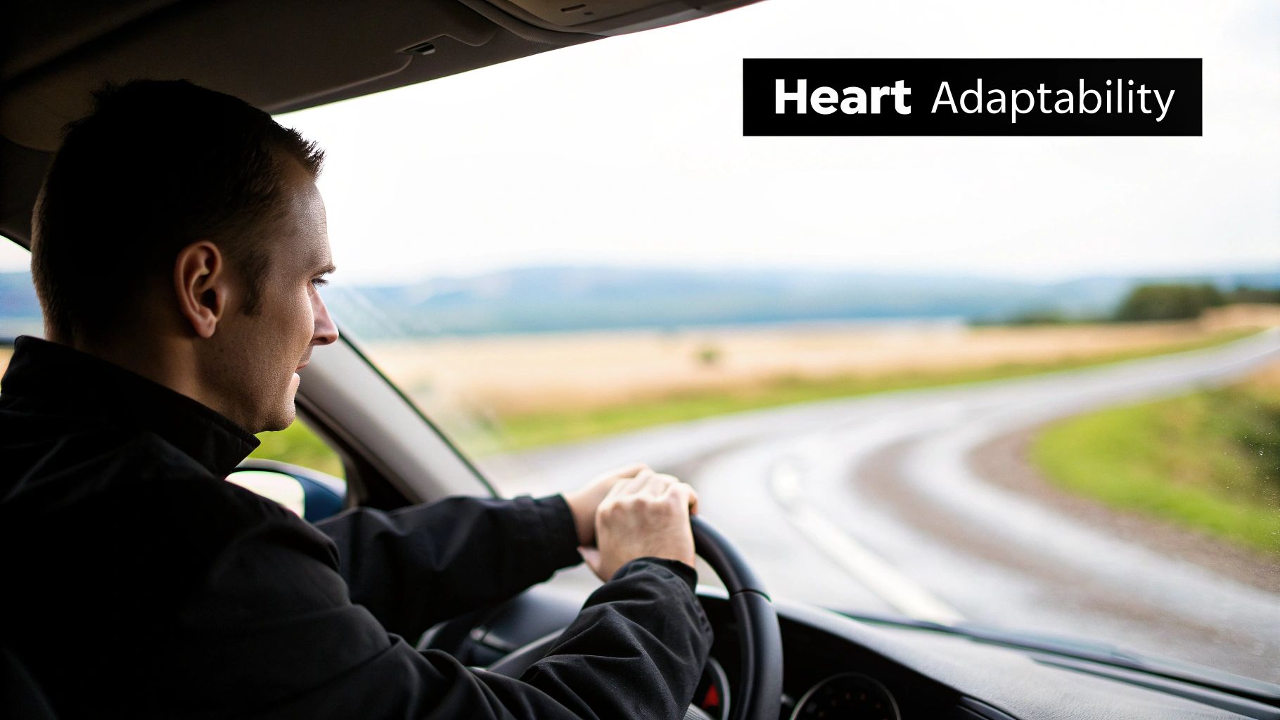 A man driving a car on a scenic winding road, with 'Heart Adaptability' text on the image.