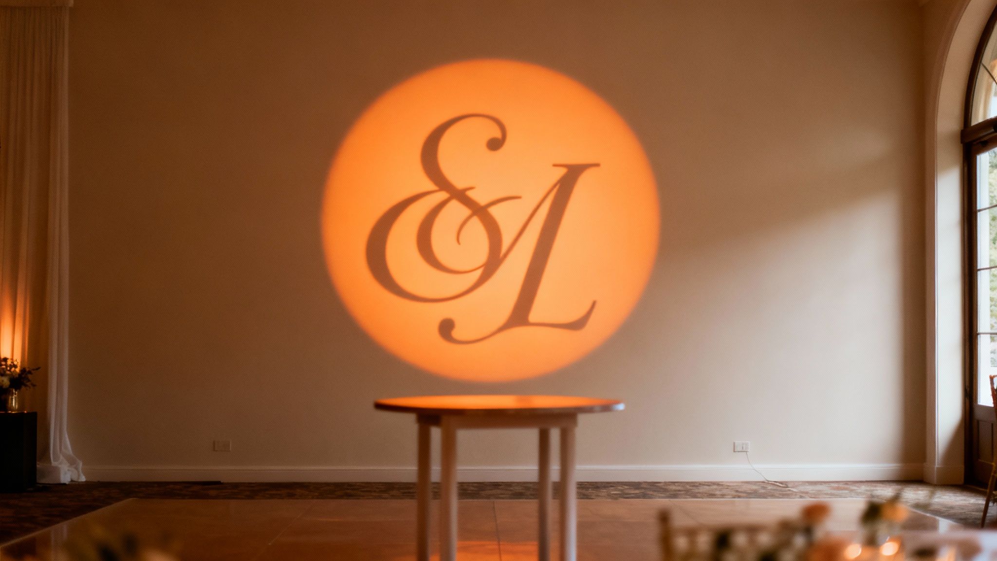 Monogram light shining on dance floor