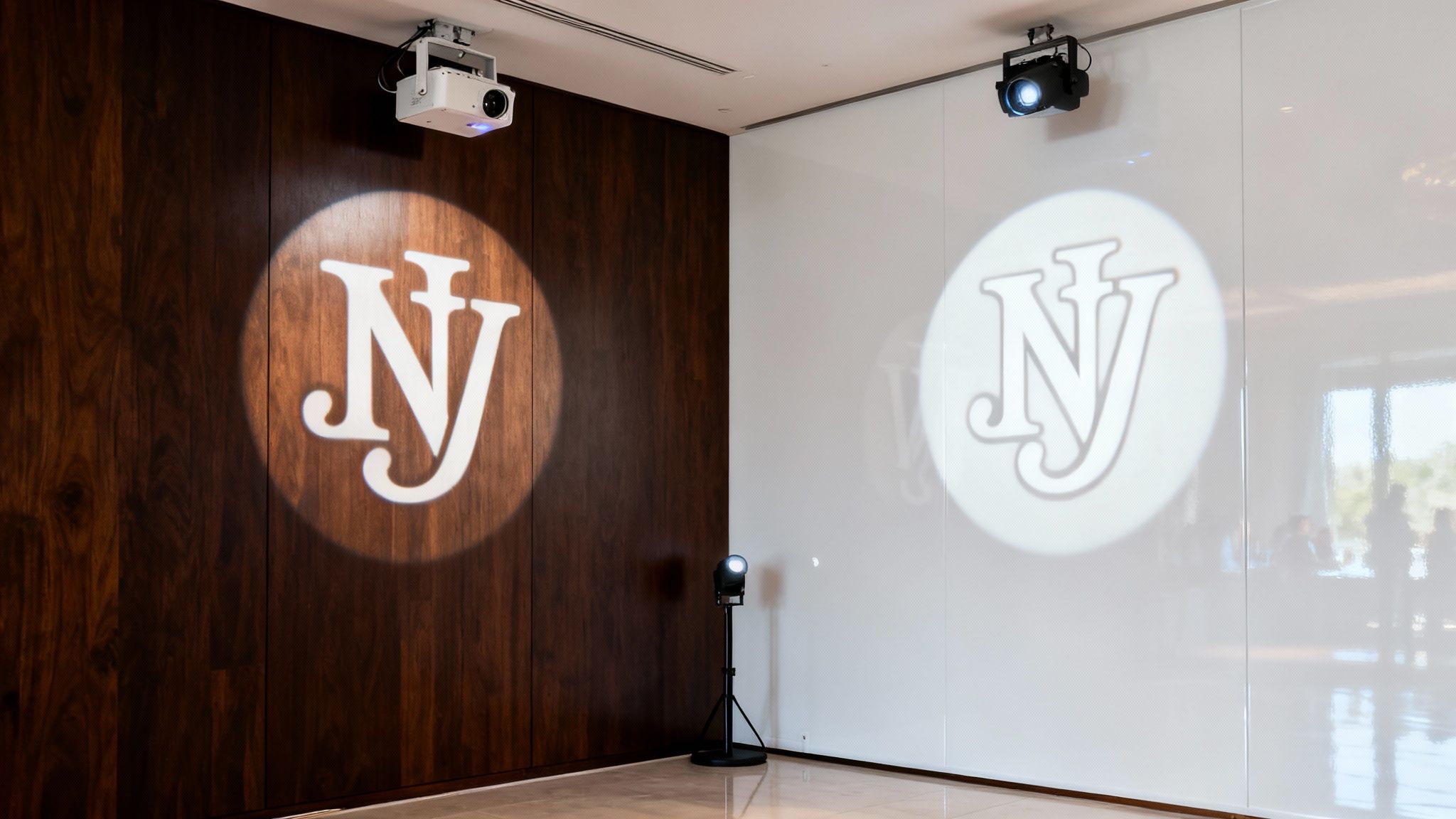 A beautiful monogram light projection on a wedding dance floor.