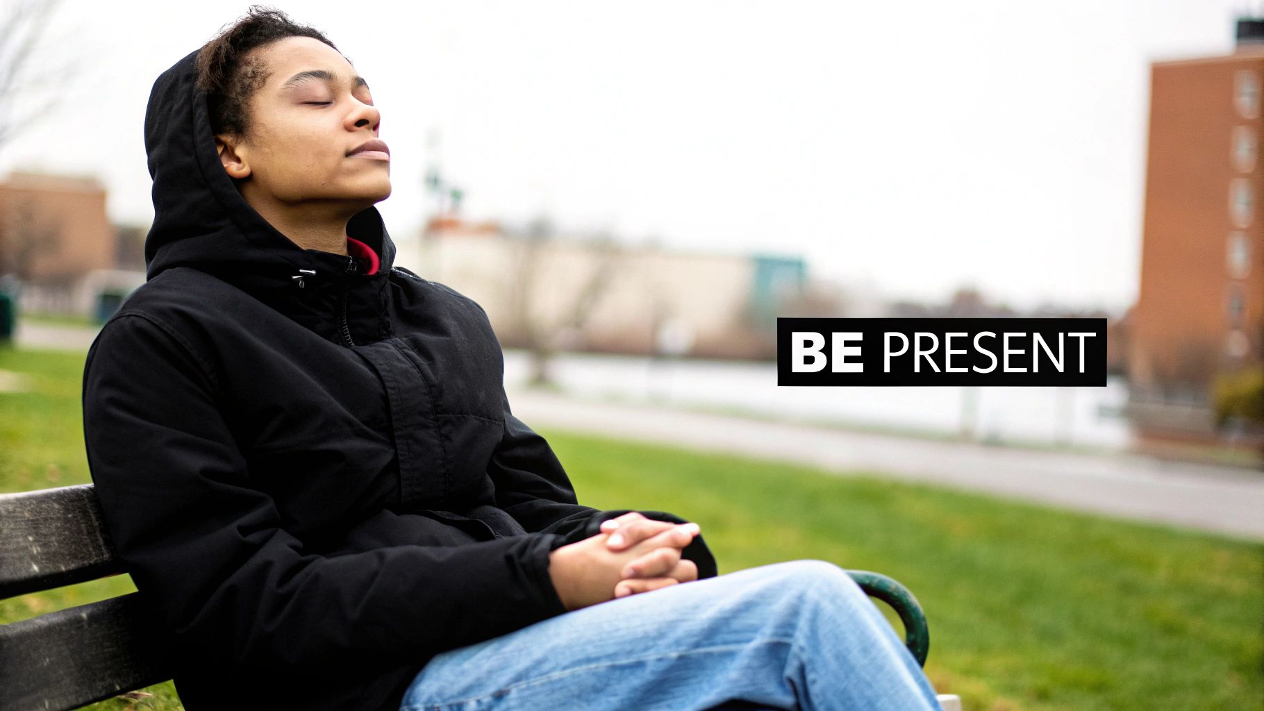 A person sitting calmly by a window, looking out at nature, embodying a state of presence.