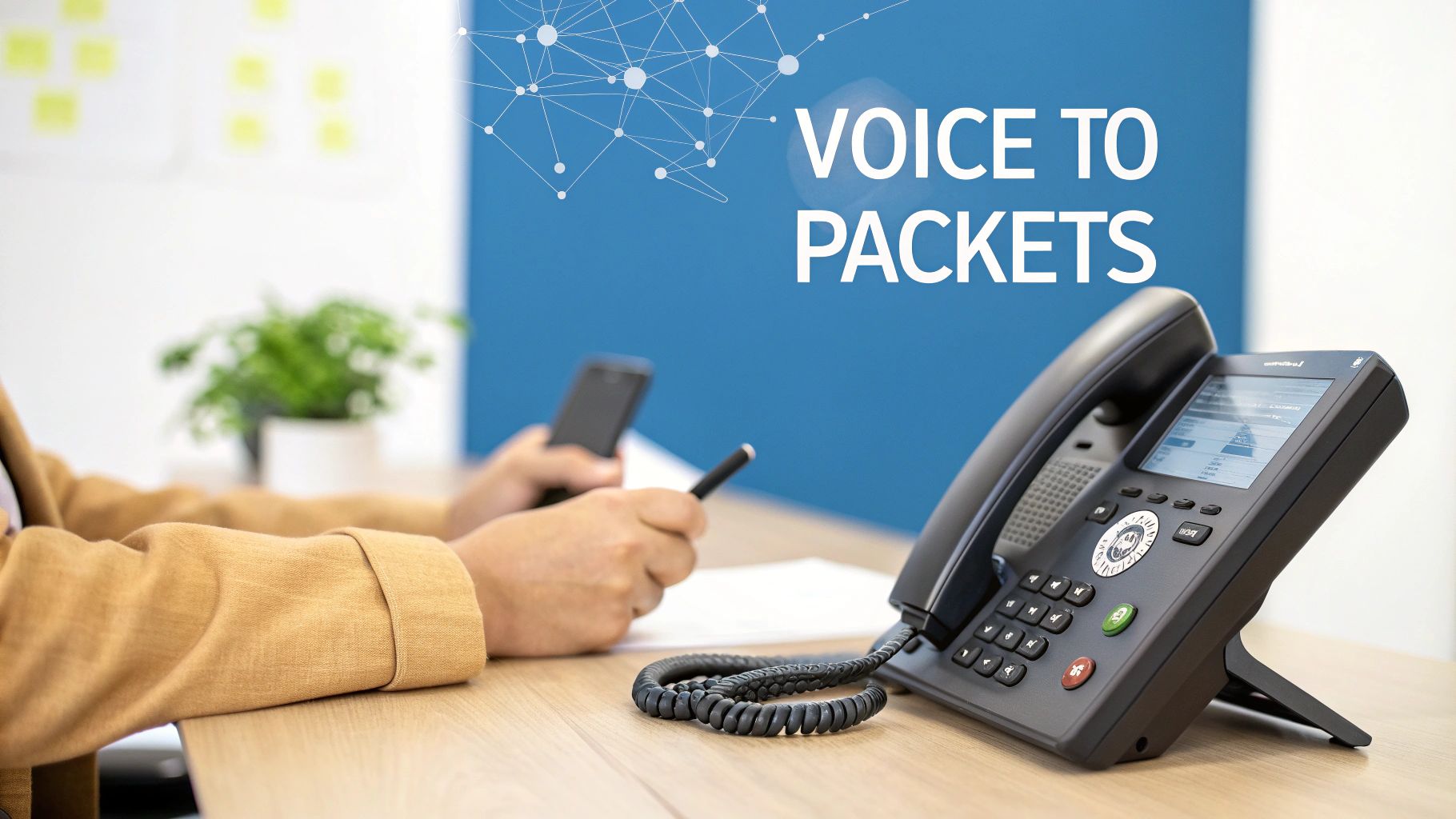 A close-up of a VoIP phone on a desk with a person using a smartphone, illustrating voice to packets technology.