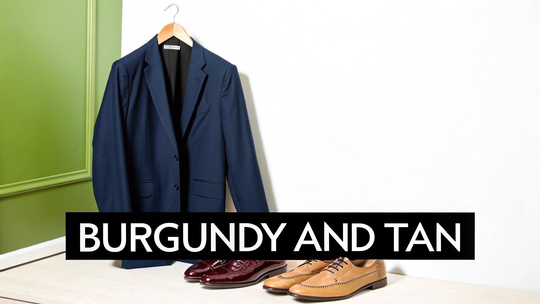 A navy suit jacket hangs, with burgundy loafers and tan brogues resting on a wooden surface.