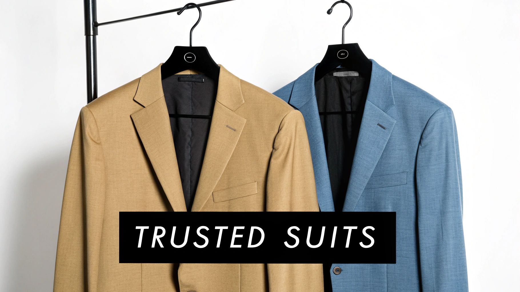 Two stylish men's suits, one tan and one blue, hang on a rack, labeled "TRUSTED SUITS".