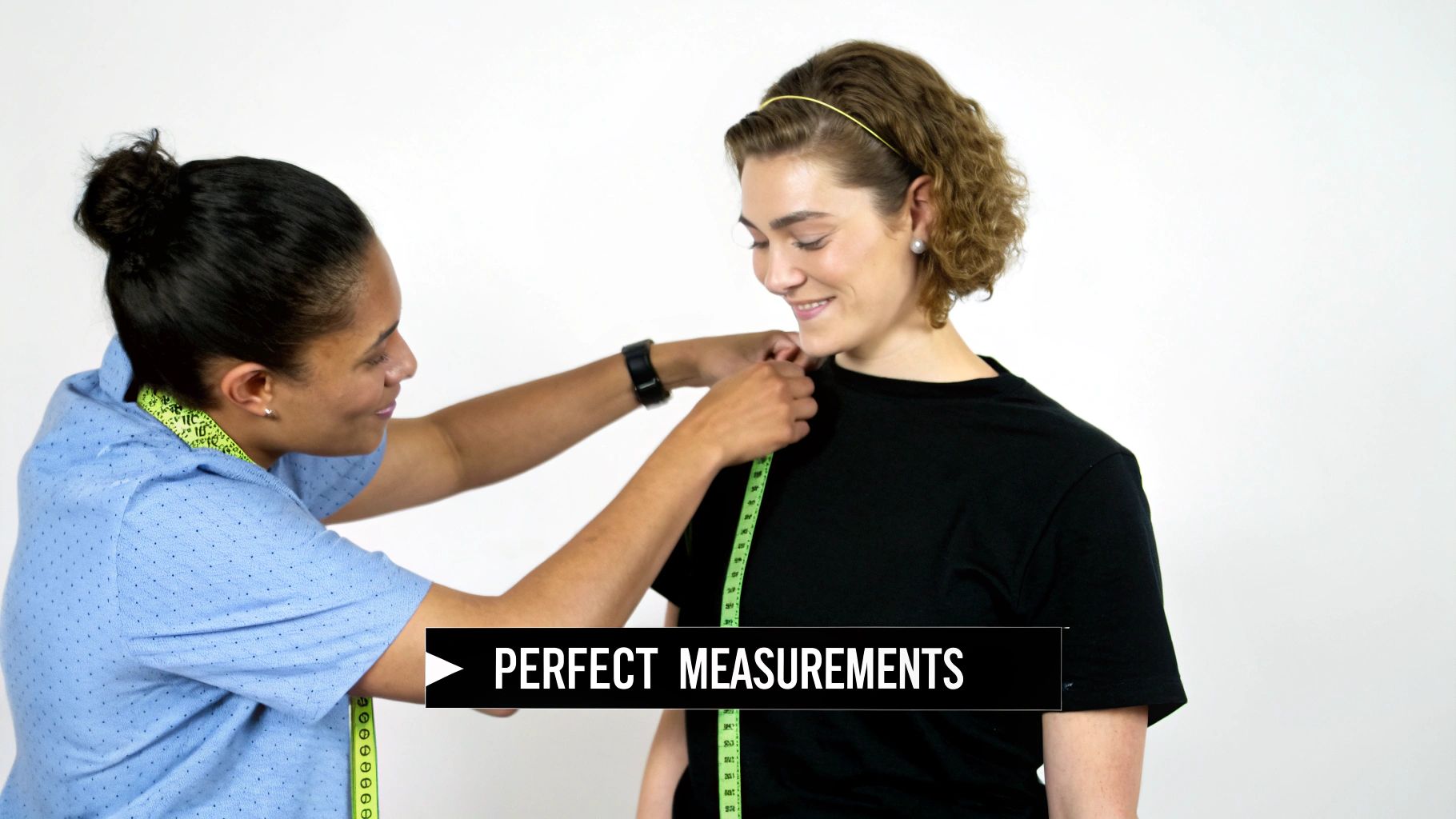 A tailor in a blue shirt measures a client's chest with a green tape for perfect measurements.