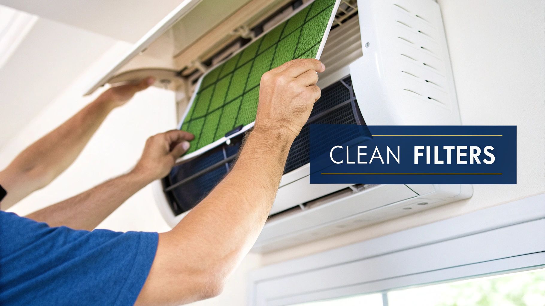 A person's hands lifting the front panel of a split system air conditioner to access the filters.