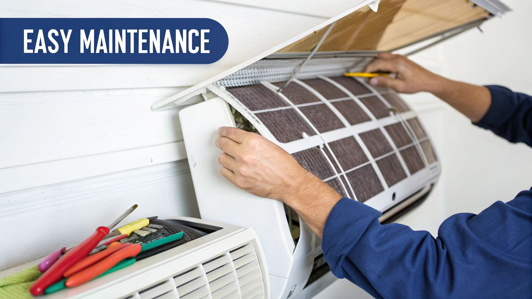 A person performs easy maintenance on a white split-system air conditioner, cleaning its dirty filter.