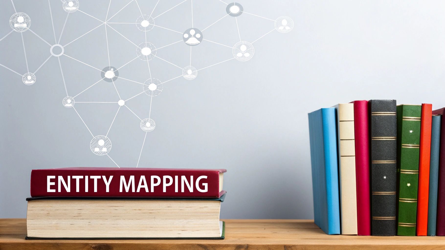A book titled 'ENTITY MAPPING' on a shelf, with a background displaying a network diagram.