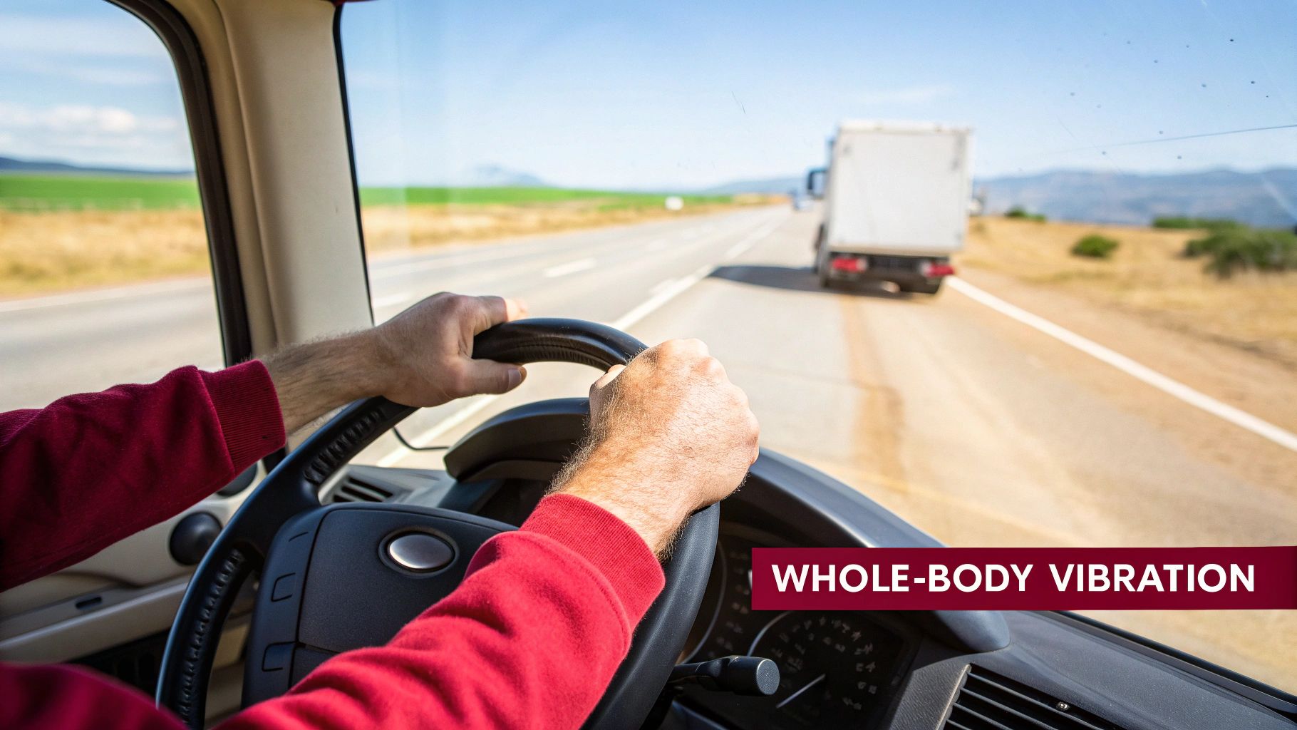 Driver's hands on a truck steering wheel on a highway, illustrating whole-body vibration.