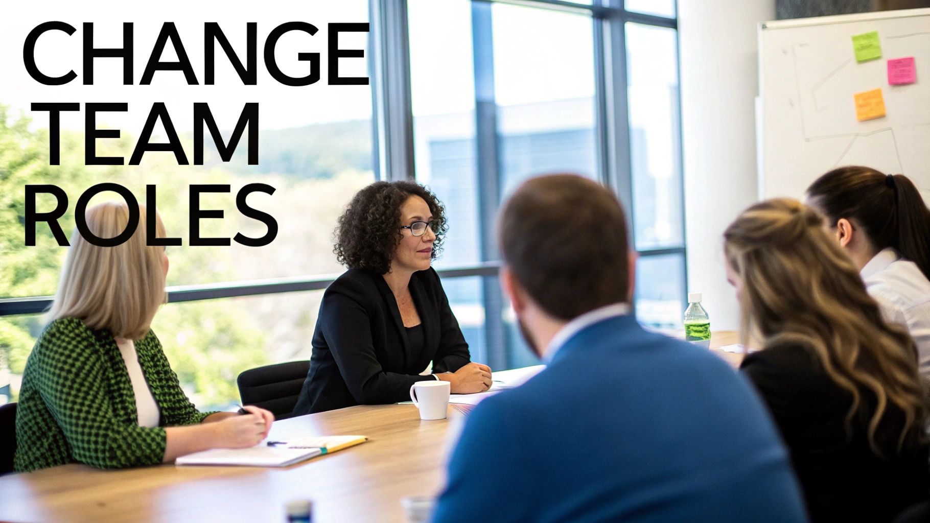 A business meeting with diverse professionals discussing change team roles in an office.