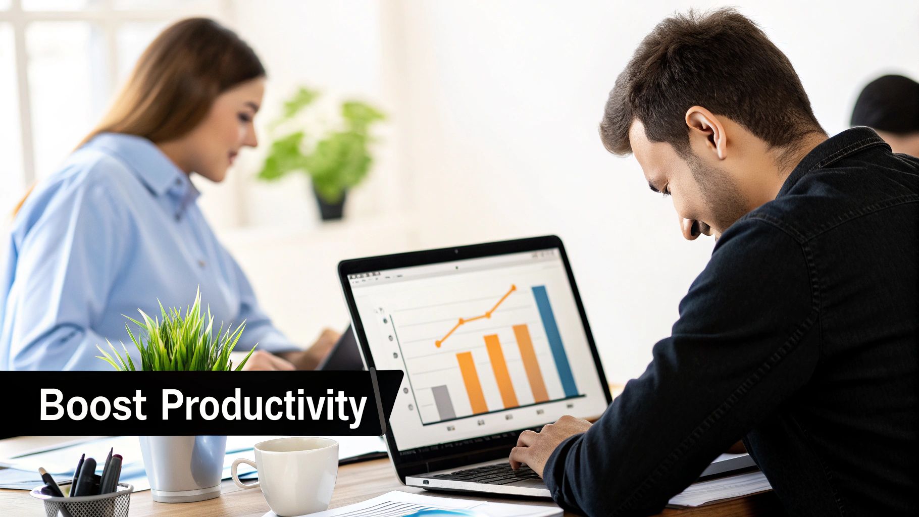 Two people working at office desks, one viewing a laptop with data charts. Text: 'Boost Productivity'.