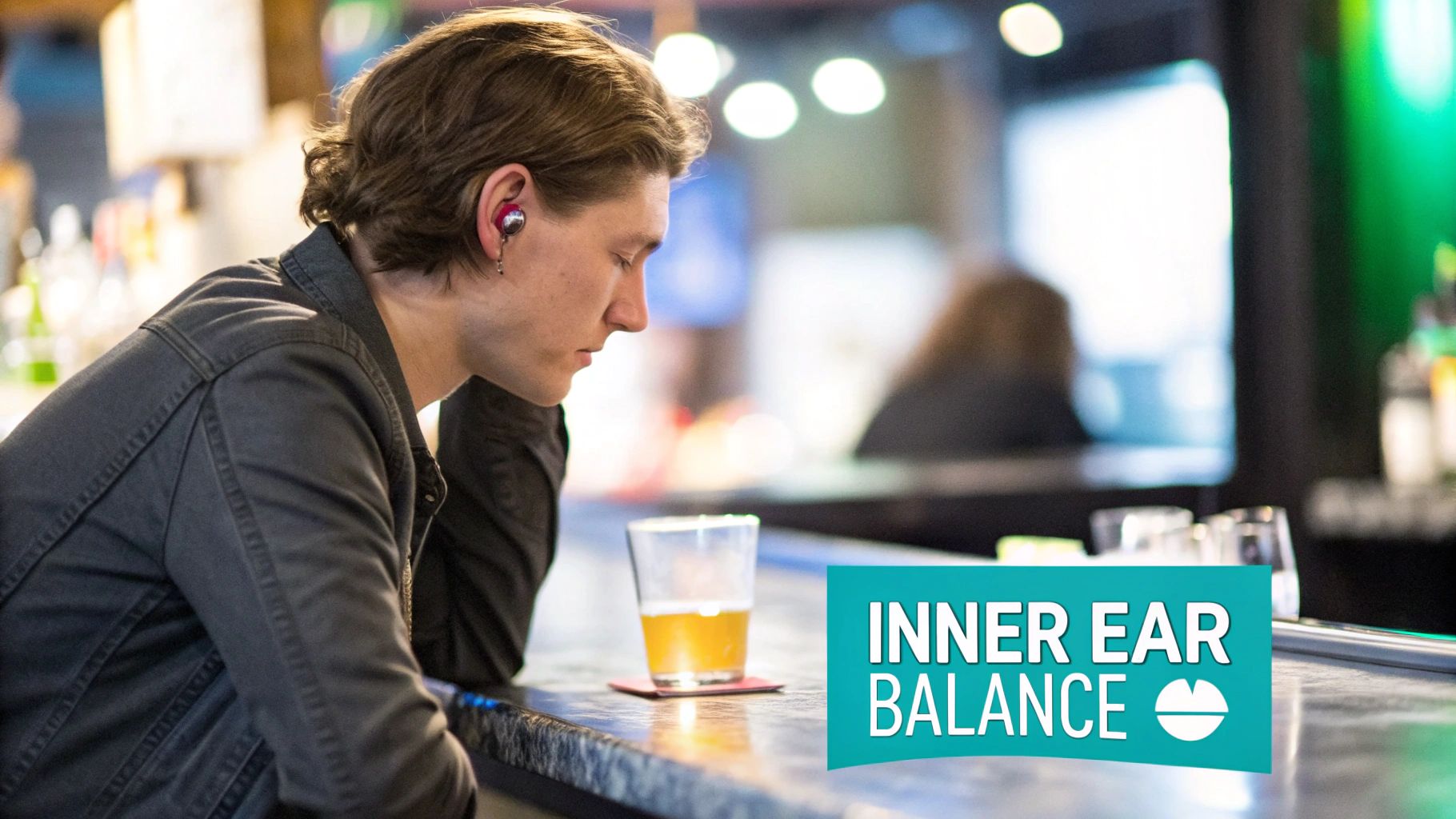 A young man with an earbud rests at a bar with a beer, promoting inner ear balance.