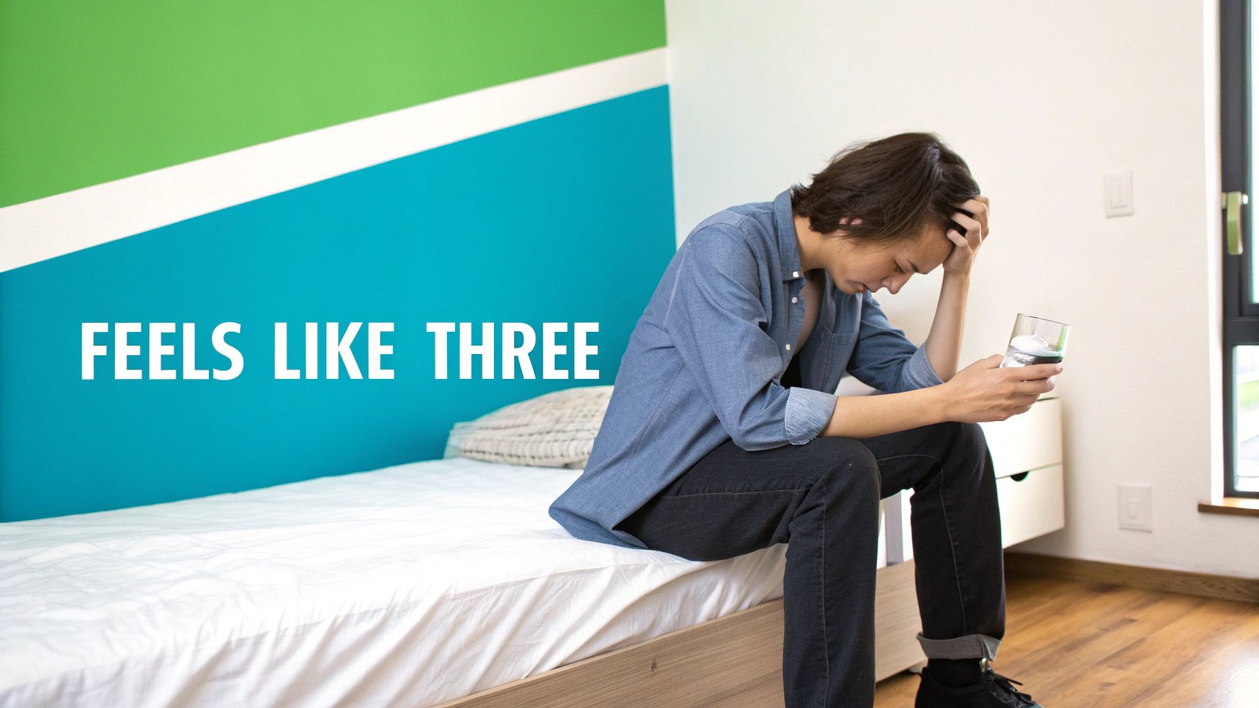 A person looking tired and holding their head, suggesting a hangover.