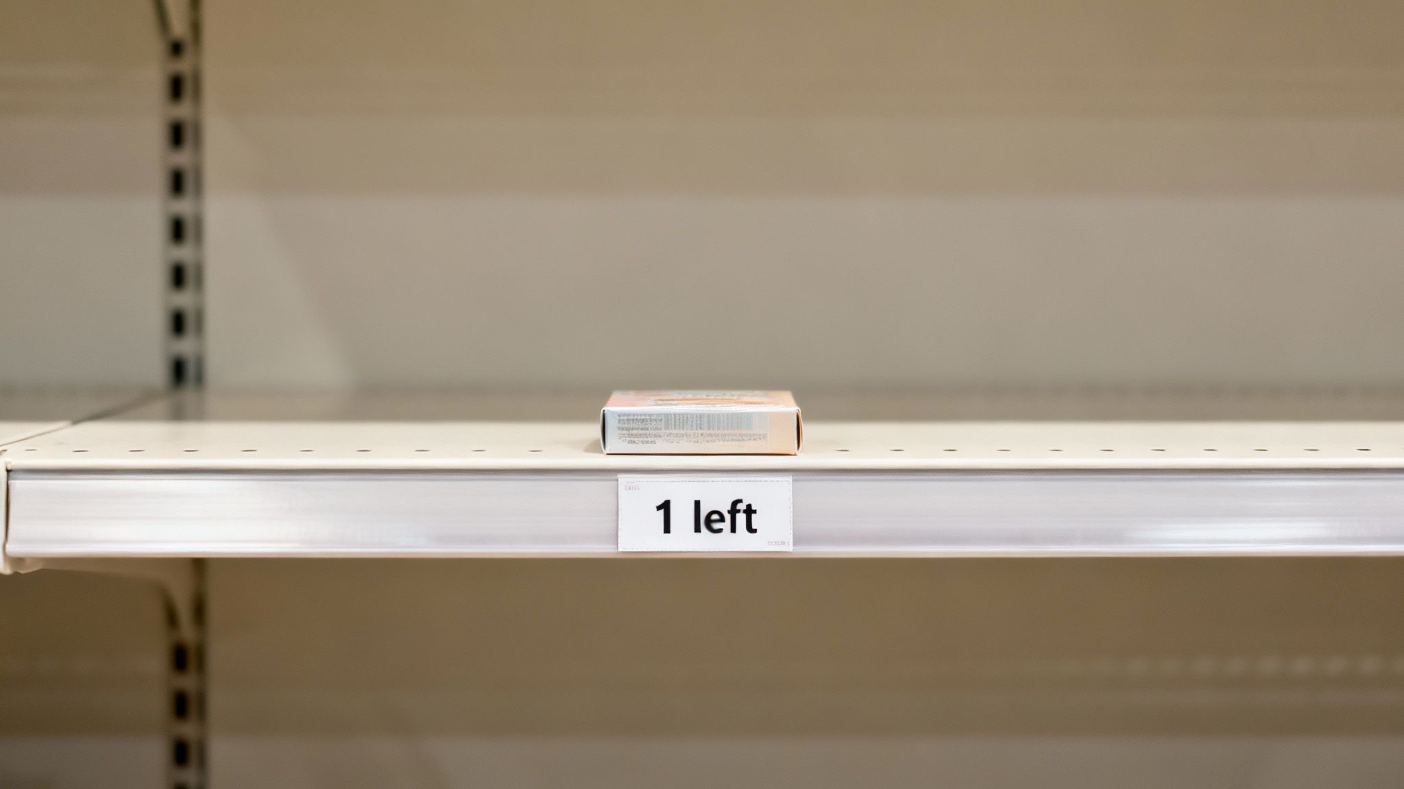 A single box sits on an otherwise empty store shelf with a '1 left' sign.